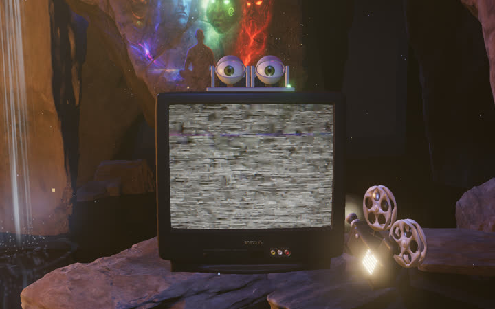 Companion: an old CRT with two animatronic eyes on top, on a rock in the cave.